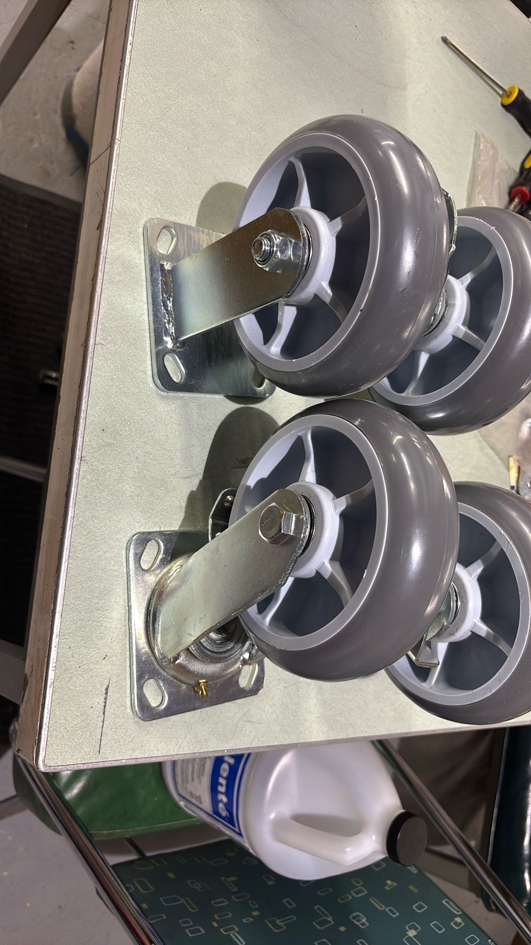 heavy-duty swivel caster wheel with a brake mechanism and a gray thermoplastic rubber