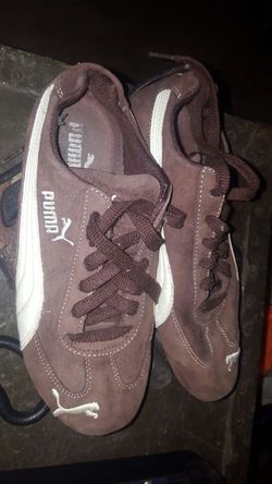 Brown suede pumas