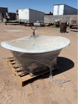 Stand alone soaking tub with whatever faucets go with it.