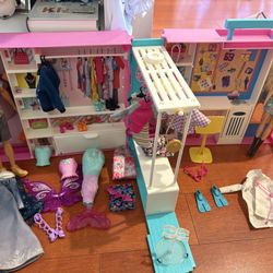 barbie closet with barbies and clothes