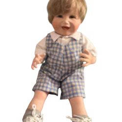 porcelain doll, possibly "Matthew" from the Picture Perfect Babies collection by Yolanda Bello for the Ashton-Drake Galleries.  The doll features blon