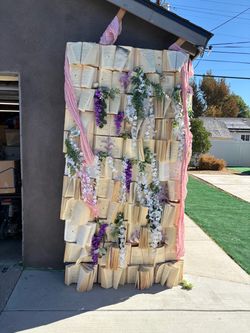 Handmade Book Wall Backdrop with Faux Flowers