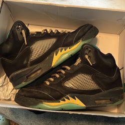 Size 7 Jordan 5s black yellow and teal used