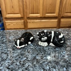 Ceramic Black and White Striped Cat Pair of Salt and Pepper Shakers.  Preowned.  Has been on display in a cabinet with a very large salt and pepper sh