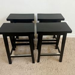 4 black barstools 