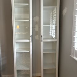 Pair of bookcases with glass doors