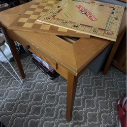Game table with monopoly, scrabble, chess