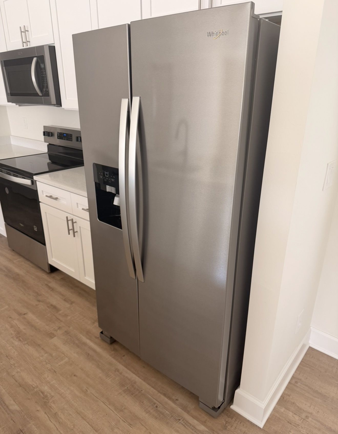 Brand New Whirlpool Fridge Side-by-side refrigerator with external ice/water dispenser