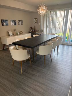 Black wood and gold table & white leather chairs