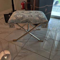 Patterned Upholstered Ottoman with Silver Metal Base