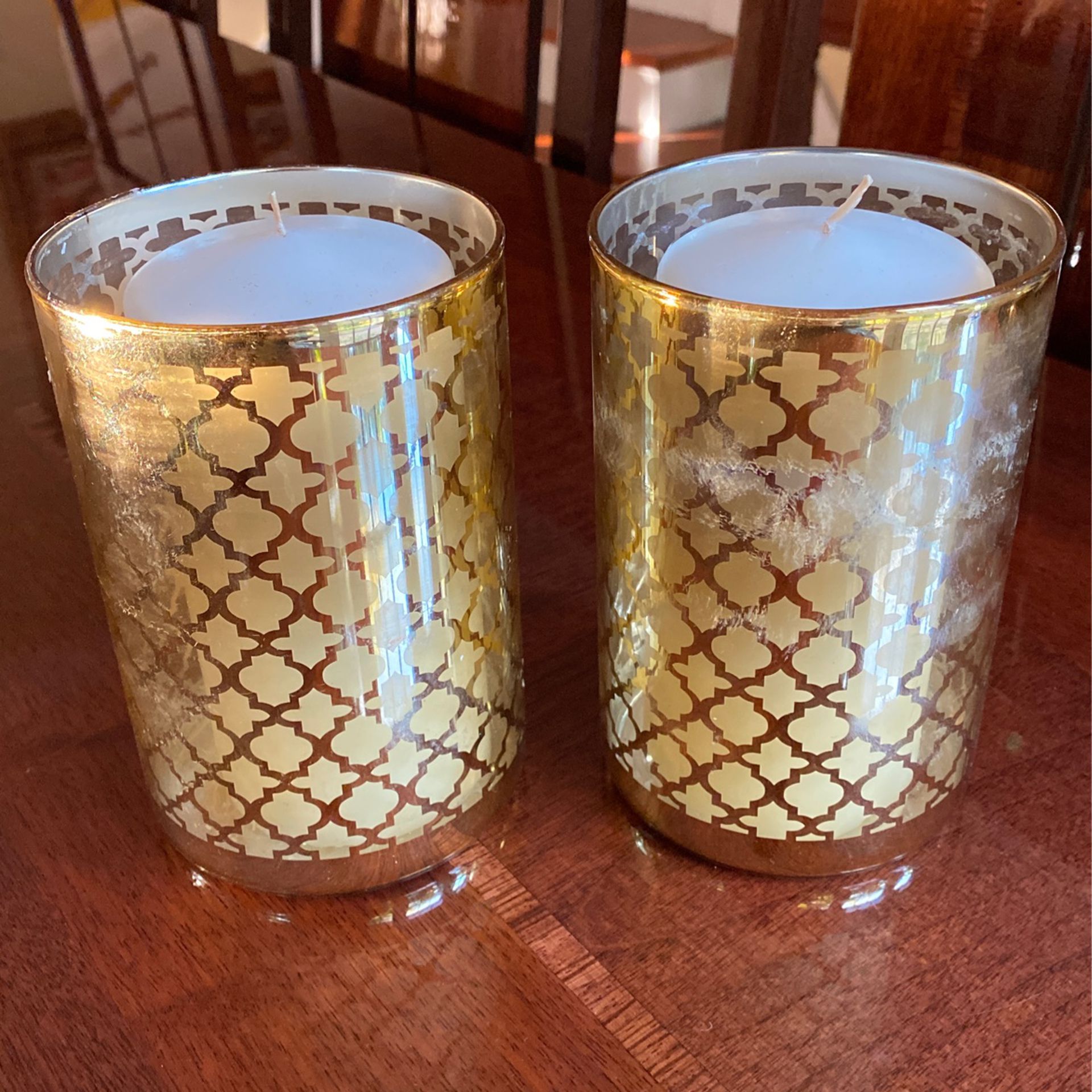 Pair of candles with holders 6 inches tall.