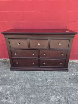 Very strong dresser with 7 drawers and all the drawers work good, structurally very sound, few niks, dings n scratches, top has patches of varnish tha