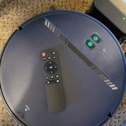 IROBOT VACUUME  WITH REMOTE AND HOME BASE CHARGE