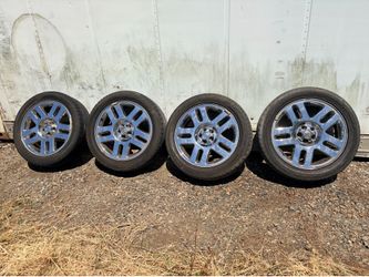 4 Ram tires and rims (Used)