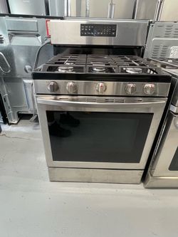 Samsung stainless steel propane gas stove; includes a receipt for a 60-day warranty.