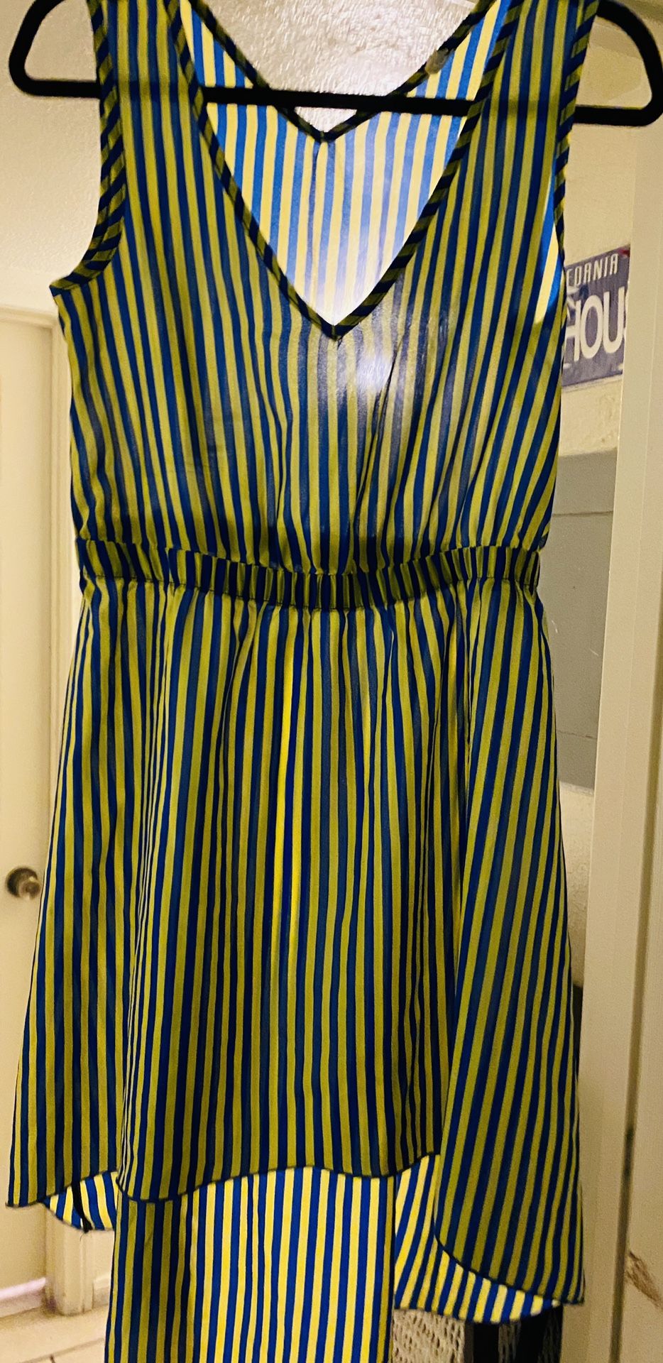 Preowned woman’s size M yellow/blue dress in great condition but a bit see through located off lake mead and jones area asking $3