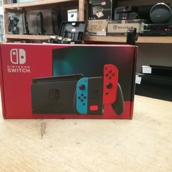 Nintendo Switch with Neon Blue and Neon Red Joy‑Con ............