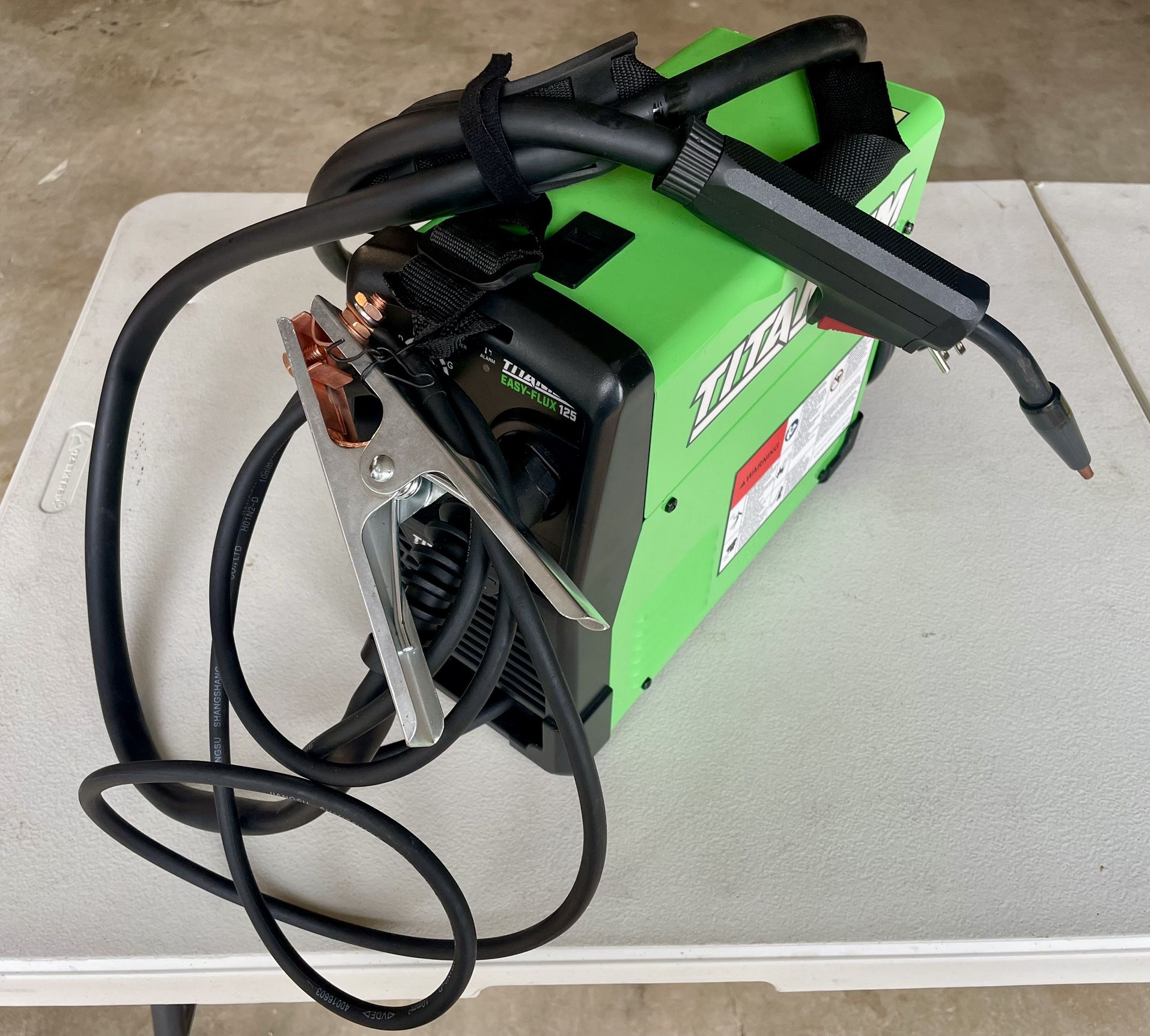 Titanium flux core welder, welding helmet, gloves