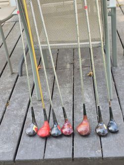 7 vintage golf clubs with wood heads