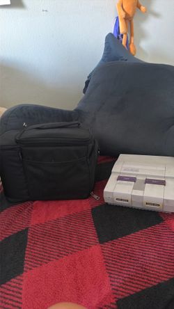SNES with cables,  controllers, and games
