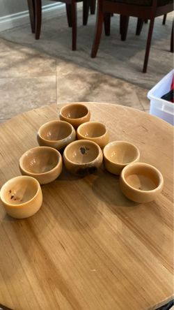 Homemade Sake shot glasses. Made from an ivory nut