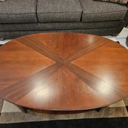 Oval Wood Coffee Table With Lower Shelf And Hidden Storage Space