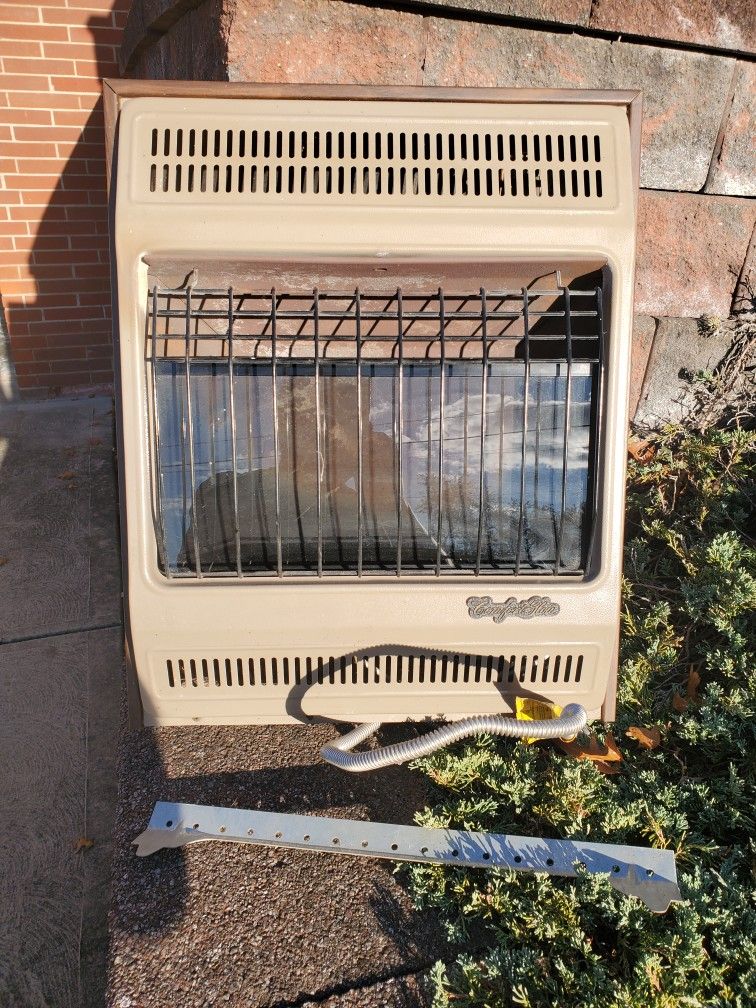 COMFORT GLOW 18,000 BTU NATURAL GAS BLUE FLAME  HEATER WITH THERMOSTAT AND WALL MOUNT IN  NICE CONDITION WORKS GOOD