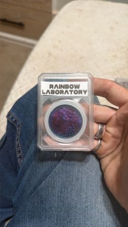 Rainbow Toned Morgan Silver Dollar Slabbed