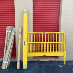 Full-size yellow frame bed