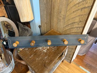 Wall mounted spool coat rack