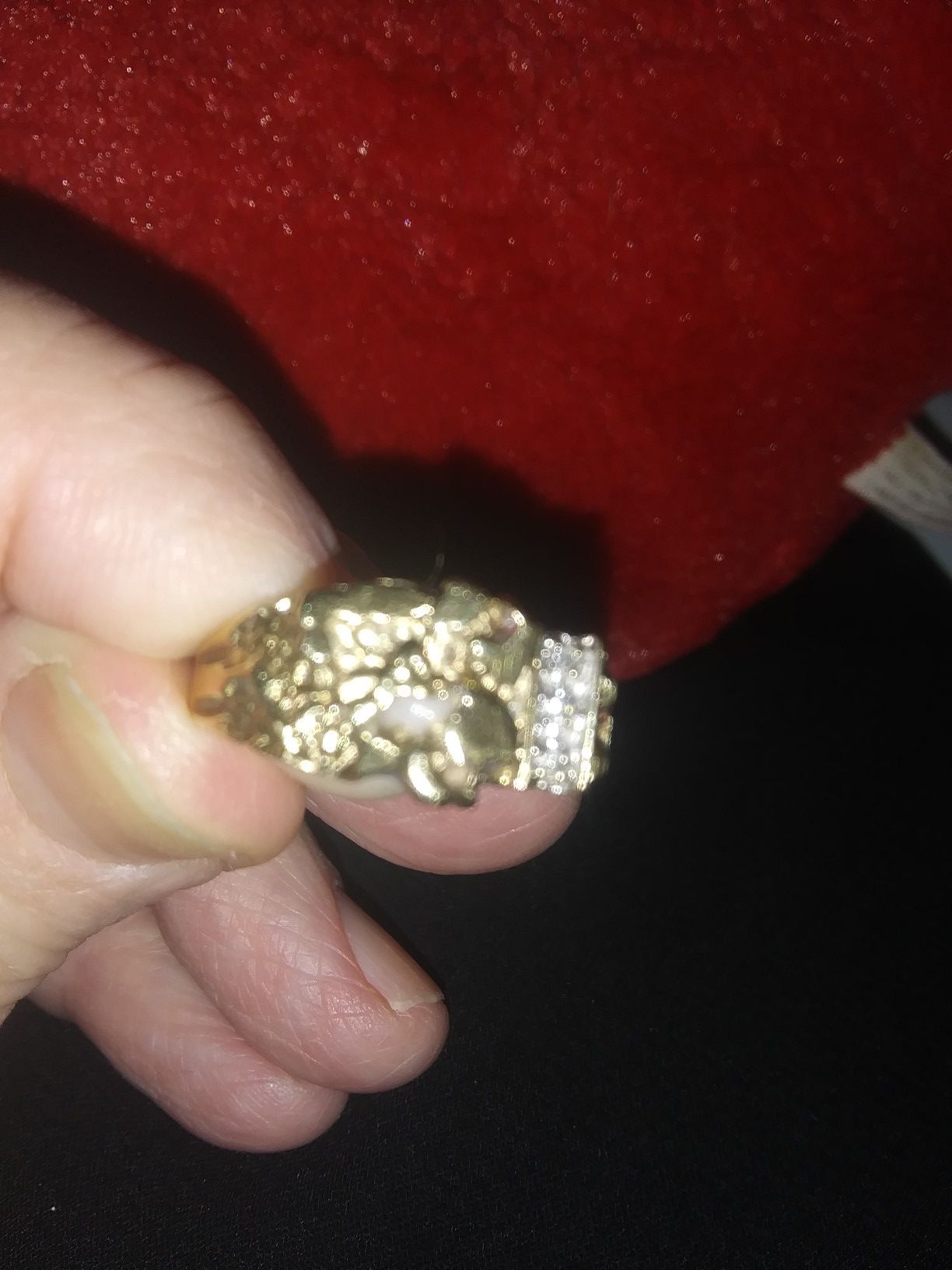 Gold nugget ring with three diamonds on the side. This ring is real. It cost 1100.00 dollar. Will sell for $400.00