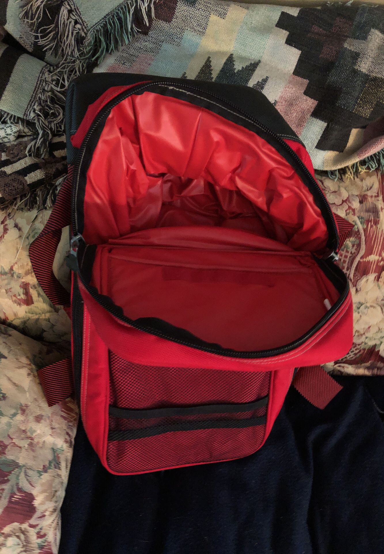 Insulated red and black backpack for food and drink