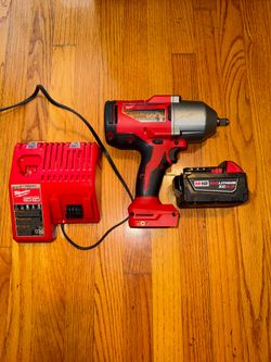 Milwaukee M18 1/2 in High Torque Impact Wrench with Rapid Charger and  M18 4.0 Ah Battery