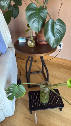 Brown and Black Round Wood and Metal Accent End Table with Black Metal Base