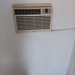 Window Air Conditions..stainless Steel Refrigerator, And Stove, And Microwave 