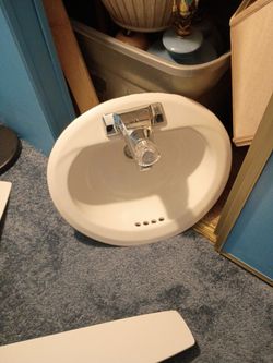 Used bathroom sink and Moen faucet