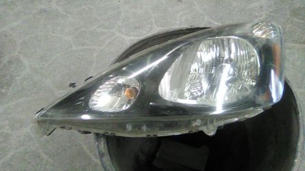 Honda fit sport driver side headlamp good for rebuilder gloss black inside not perfect but can be fixed