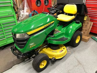 John Deere X300 42” deck with bagger and mulch plug 107.2 hours