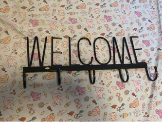 Welcome sign with hooks