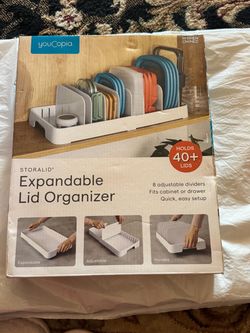 StoraLid expandable lid organizer keeps pot and container lids neatly stored. White design with adjustable dividers fits cabinets or drawers. Easy set