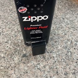 Zippo Lighter And Bottle Of Fluid