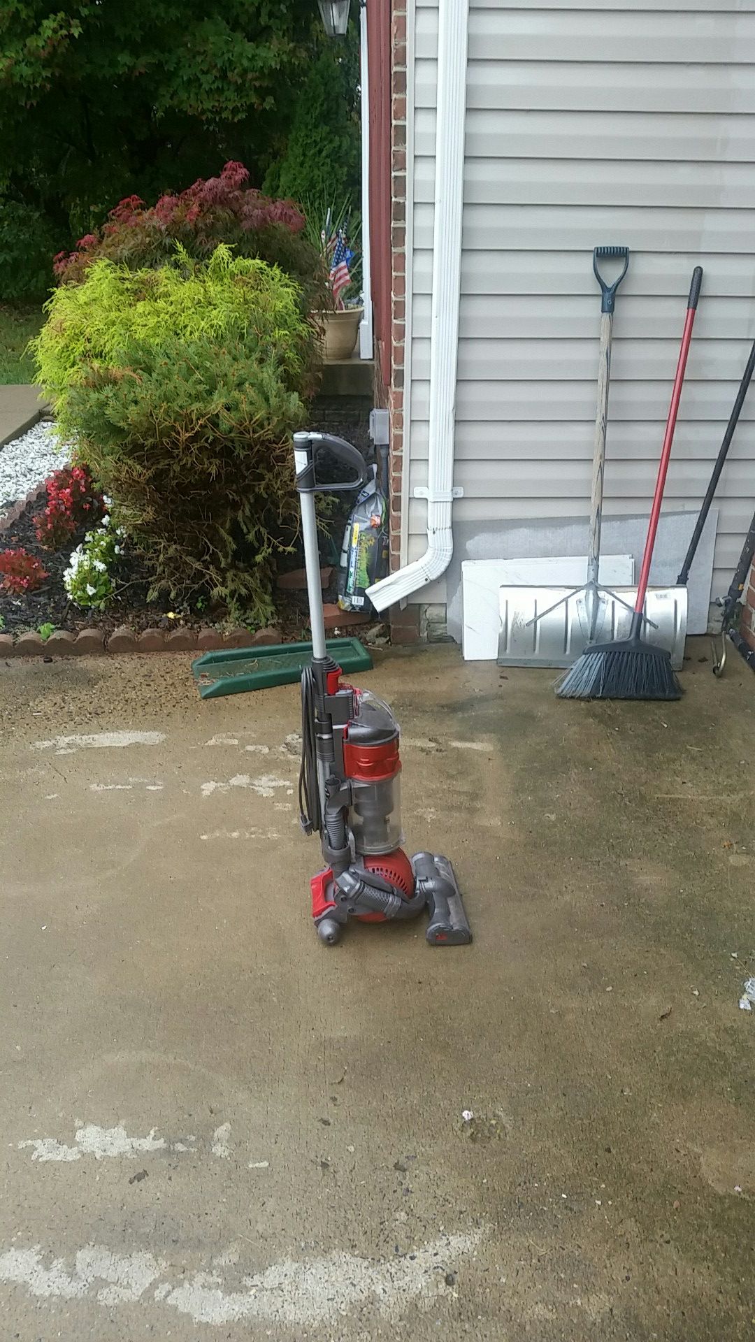 Red and gray Dyson vacuum