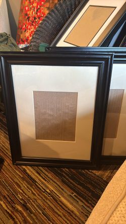 4 black matted frames