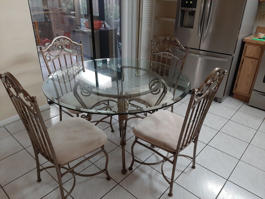 Kitchen table and four chairs. Very good condition, $250