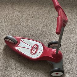 Radio Flyer red, 3-wheeled scooter for young children.
