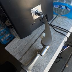 Monitor with Adjustable Arm – Desk Setup