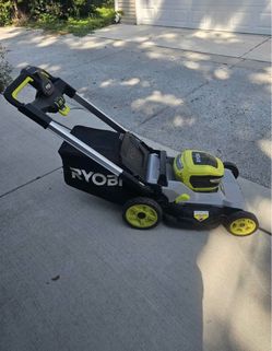 Selling RYOBI Lawnmower with Battery and Charger.