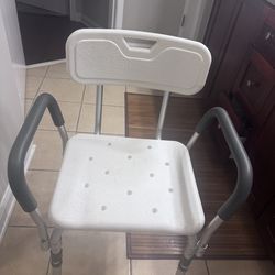 Shower chair with removeable arm rests