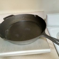 15 INCH  &  18 INCH. CAST. IRON. PAN