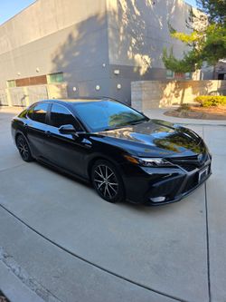 2021 Toyota Camry Hybrid $12,900